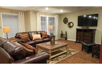 Living room with brown leather couch